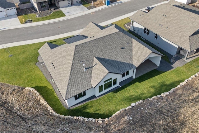 birds eye view of property with a residential view