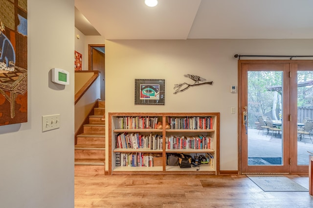 entryway with stairway and wood finished floors