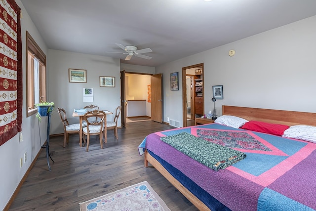 bedroom with visible vents, wood finished floors, a ceiling fan, and baseboards