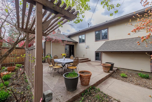 view of patio featuring fence and a pergola