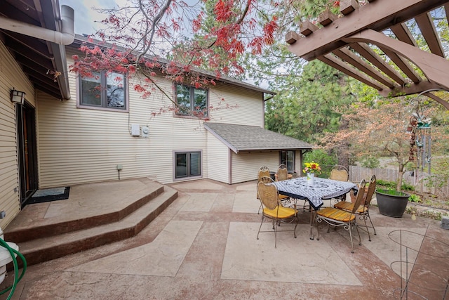 view of patio / terrace with a pergola and outdoor dining space