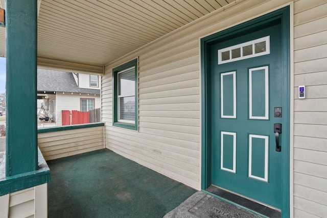 property entrance featuring a porch