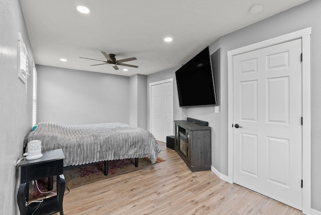 bedroom featuring a closet, recessed lighting, a ceiling fan, and light wood-style floors