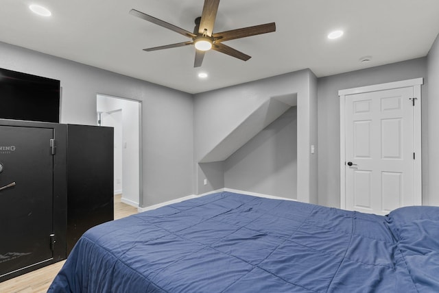 bedroom featuring recessed lighting, ceiling fan, baseboards, and wood finished floors