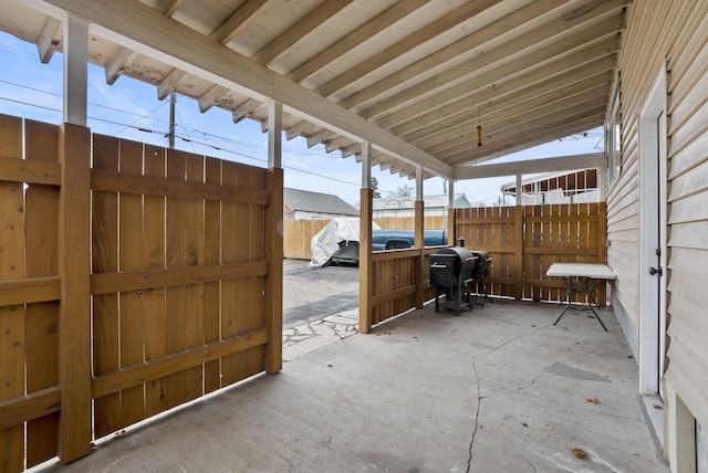 view of patio / terrace with grilling area and fence