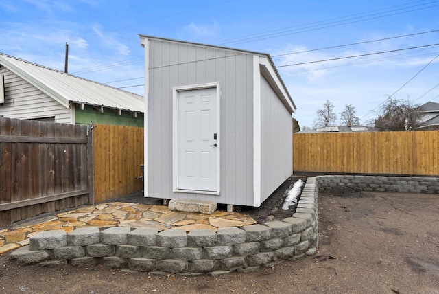 view of shed featuring a fenced backyard