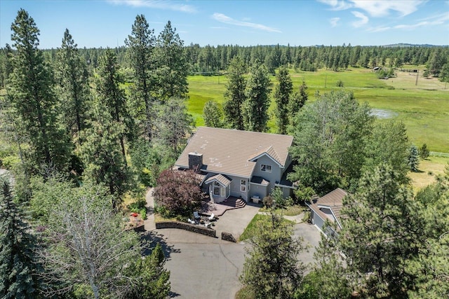 drone / aerial view featuring a forest view