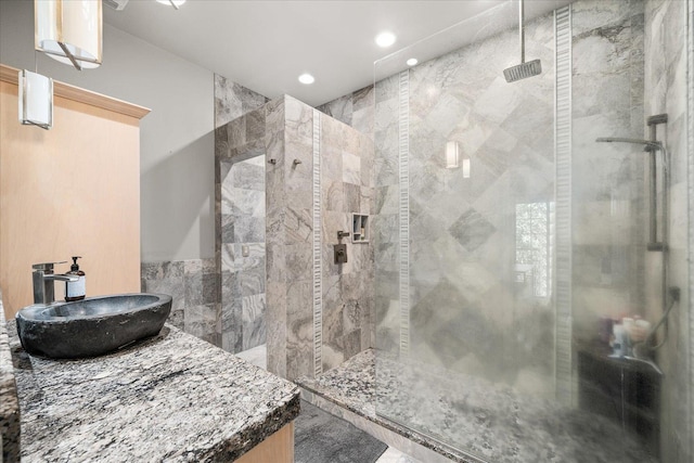 full bathroom with a shower stall, vanity, and recessed lighting