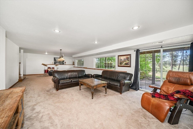 living room featuring baseboards, carpet floors, visible vents, and recessed lighting