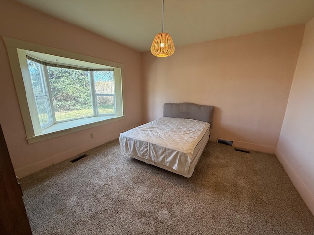 bedroom featuring carpet, visible vents, and baseboards