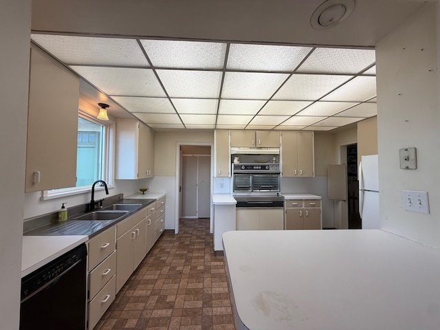 kitchen with wall oven, black dishwasher, freestanding refrigerator, under cabinet range hood, and a sink