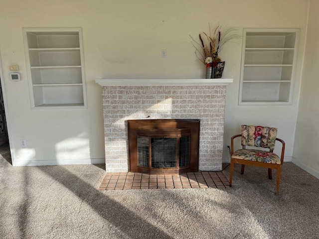 details featuring built in features, carpet flooring, a fireplace, and baseboards