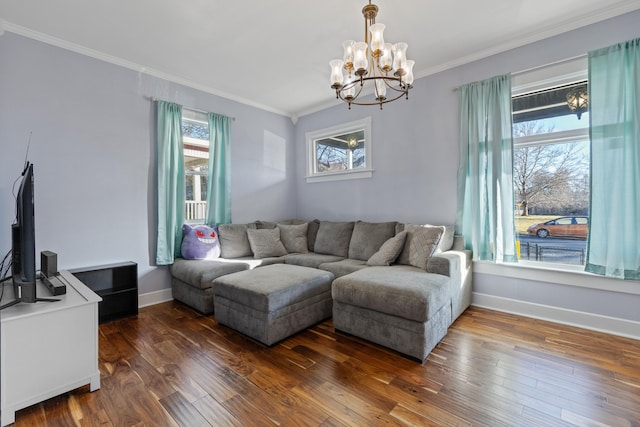 living room with ornamental molding, baseboards, and wood finished floors