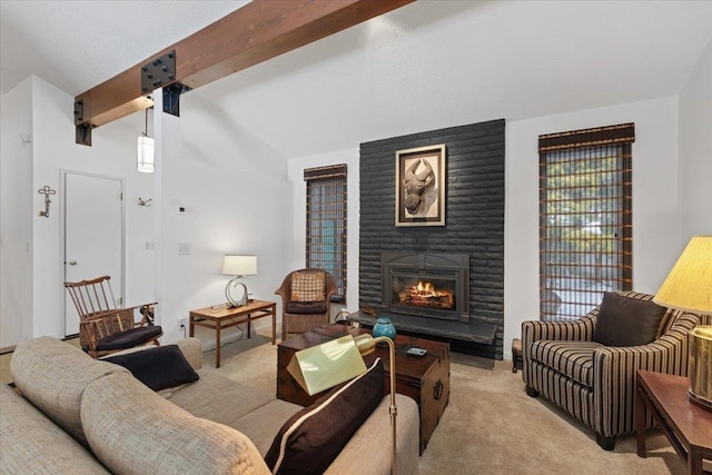 living room with a large fireplace, beamed ceiling, and light colored carpet