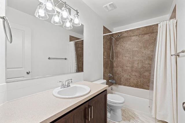 bathroom featuring visible vents, toilet, marble finish floor, shower / bath combination with curtain, and vanity