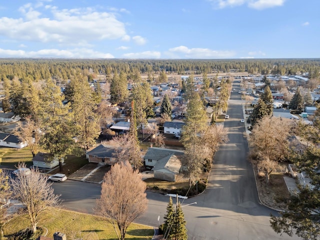 aerial view featuring a wooded view