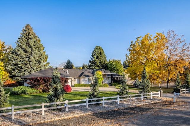 view of front of house with a fenced front yard and a front yard