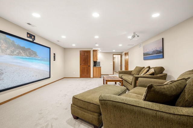 cinema with baseboards, recessed lighting, and light colored carpet