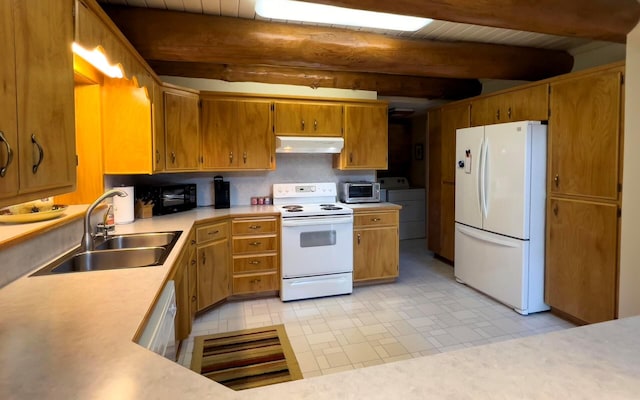 kitchen with under cabinet range hood, white appliances, a sink, light countertops, and beamed ceiling