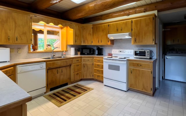 kitchen with under cabinet range hood, white appliances, a sink, light countertops, and washer / clothes dryer