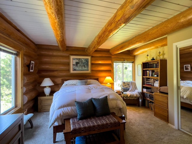 bedroom with rustic walls, carpet floors, and beam ceiling