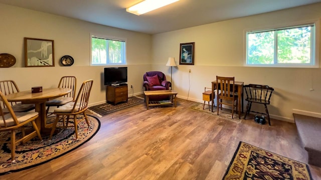 dining room featuring baseboards and wood finished floors