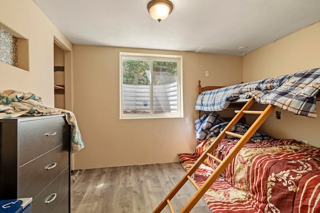 bedroom featuring wood finished floors