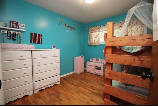 bedroom featuring wood finished floors