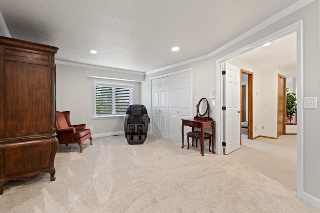 living area with baseboards, ornamental molding, and light colored carpet