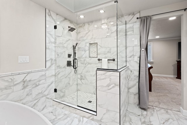 bathroom featuring recessed lighting, a freestanding bath, marble finish floor, a shower stall, and crown molding