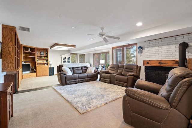 living room featuring carpet floors, ceiling fan, visible vents, and recessed lighting