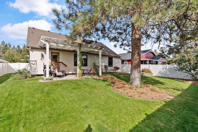 back of property with a fenced backyard, a lawn, a patio, and a pergola