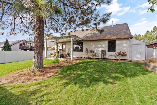 back of house with a patio, fence, a lawn, roof with shingles, and a pergola