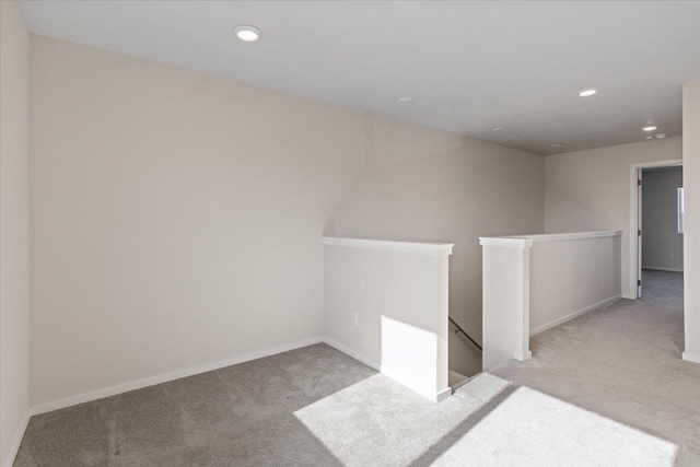 interior space featuring carpet floors, recessed lighting, and baseboards