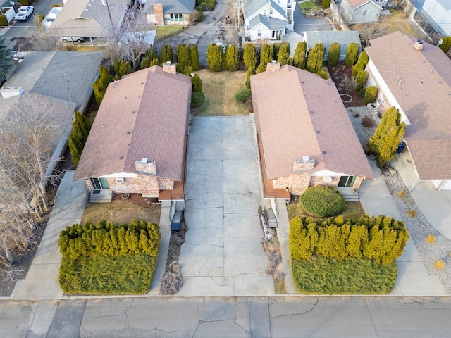 birds eye view of property with a residential view