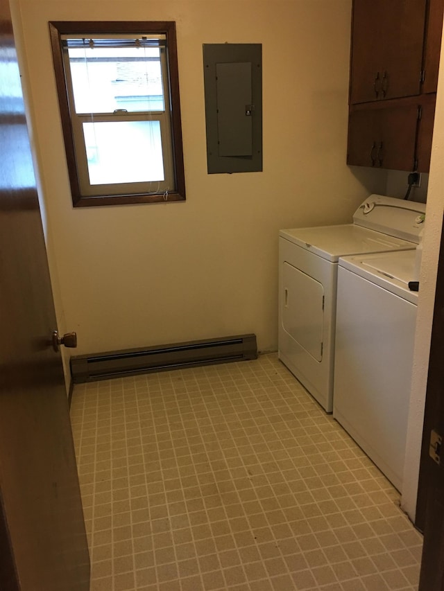 clothes washing area featuring cabinet space, electric panel, separate washer and dryer, and baseboard heating