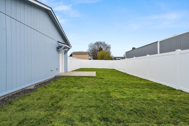 view of yard featuring a patio area and a fenced backyard