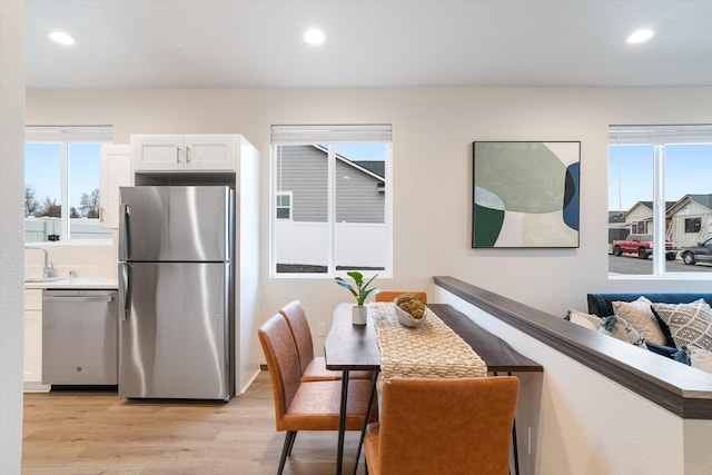 kitchen featuring plenty of natural light, light wood-style flooring, stainless steel appliances, and recessed lighting