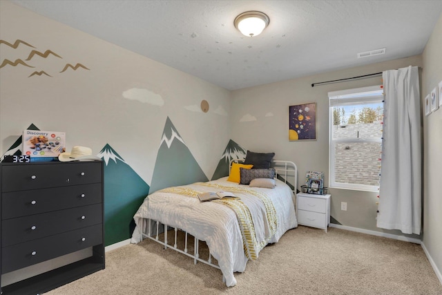 bedroom featuring a textured ceiling, carpet flooring, visible vents, and baseboards