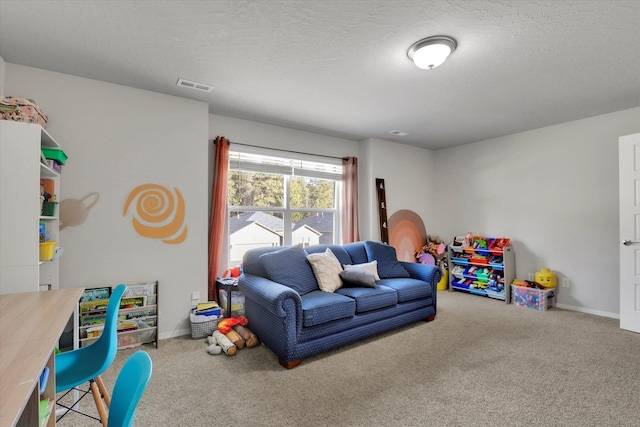 recreation room with a textured ceiling, visible vents, and carpet flooring