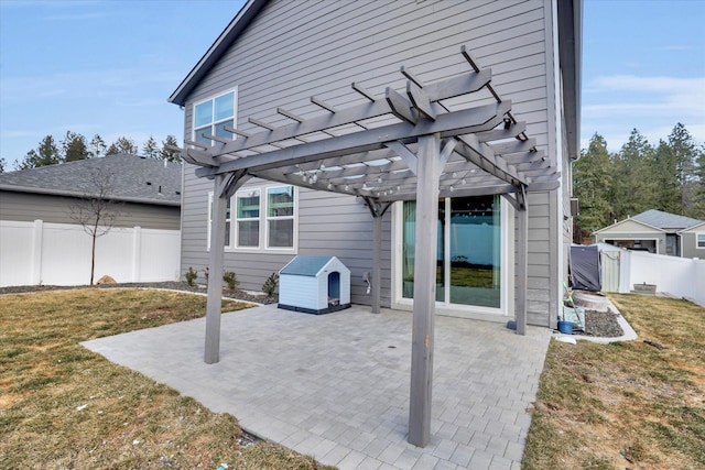 view of patio featuring fence and a pergola