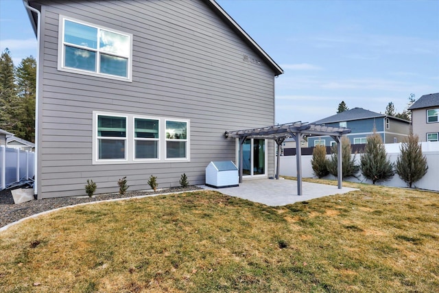 back of property with a lawn, a patio, fence, and a pergola