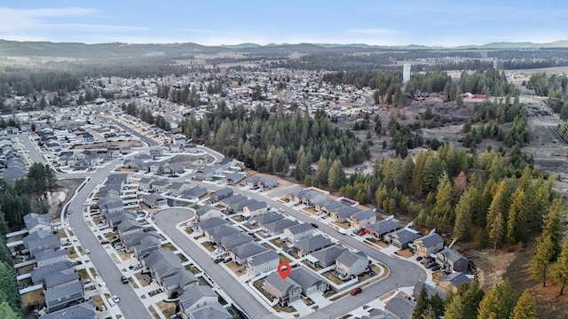 birds eye view of property featuring a residential view and a mountain view