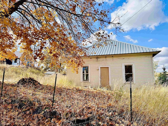 exterior space featuring metal roof