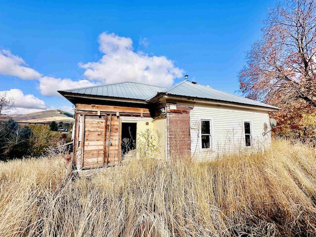 exterior space with metal roof