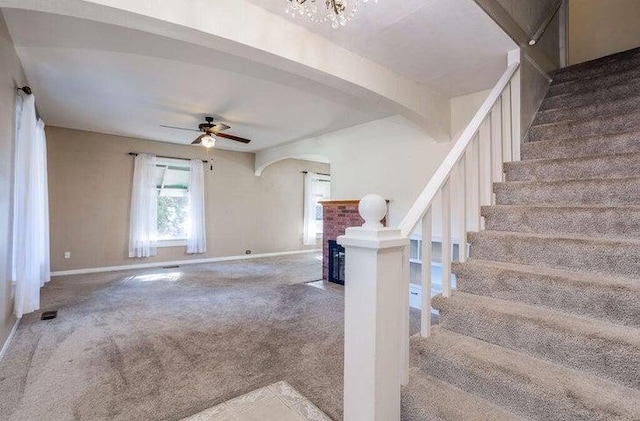 603 N Main St, Colville, WA 99114 - stairs with carpet, a fireplace, baseboards, and ceiling fan