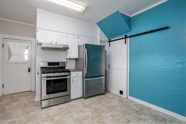 603 N Main St, Colville, WA 99114 - kitchen with stainless steel appliances, under cabinet range hood, crown molding, white cabinetry, and a barn door