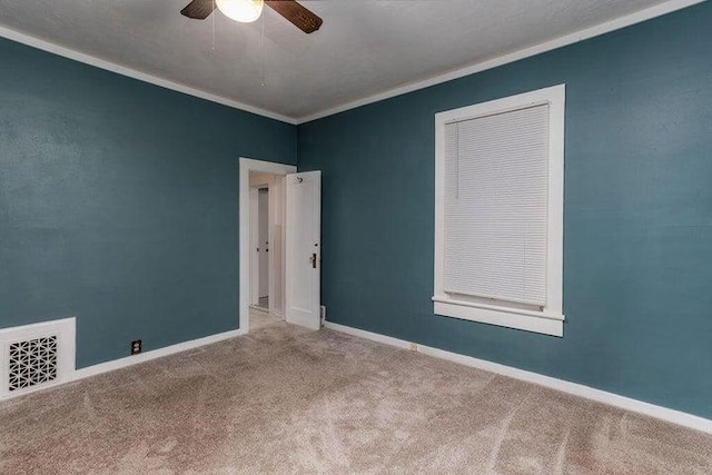 603 N Main St, Colville, WA 99114 - carpeted empty room with ornamental molding, ceiling fan, and baseboards