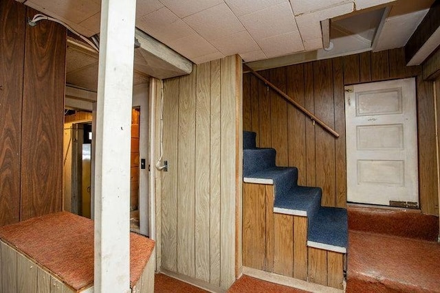 603 N Main St, Colville, WA 99114 - staircase featuring wooden walls and carpet
