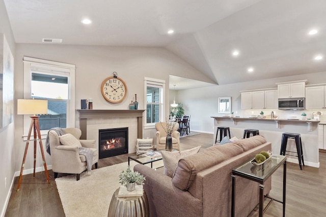 living area featuring a healthy amount of sunlight and light wood finished floors